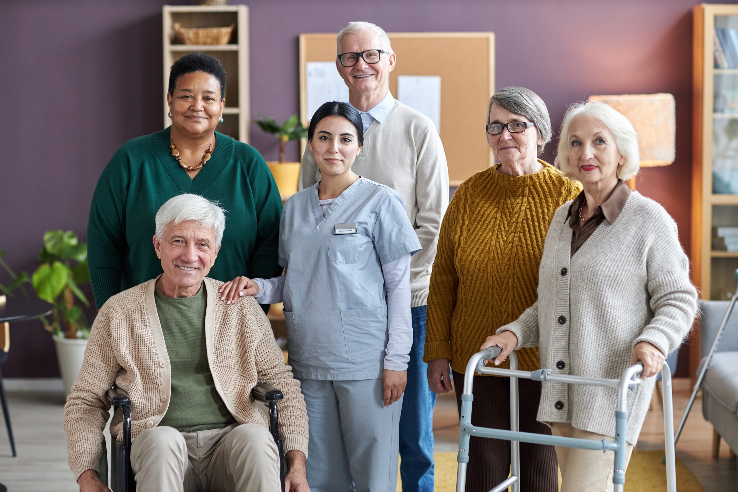 Professional care team supporting older adults and individuals with disabilities